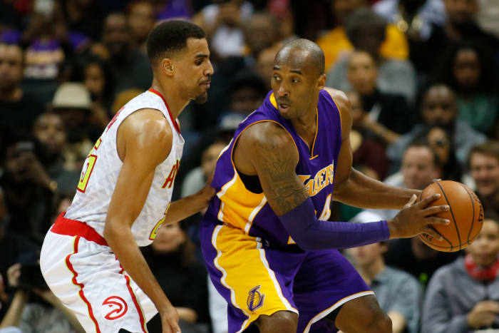 Atlanta Hawks guard Thabo Sefolosha (25) defends Los Angeles Lakers forward Kobe Bryant (24) in the third quarter at Philips Arena. The Hawks defeated the Lakers 100-87